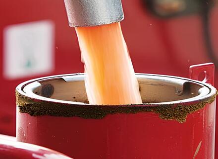Red Diesel Being poured in a red container using a fuel dispenser nozzle